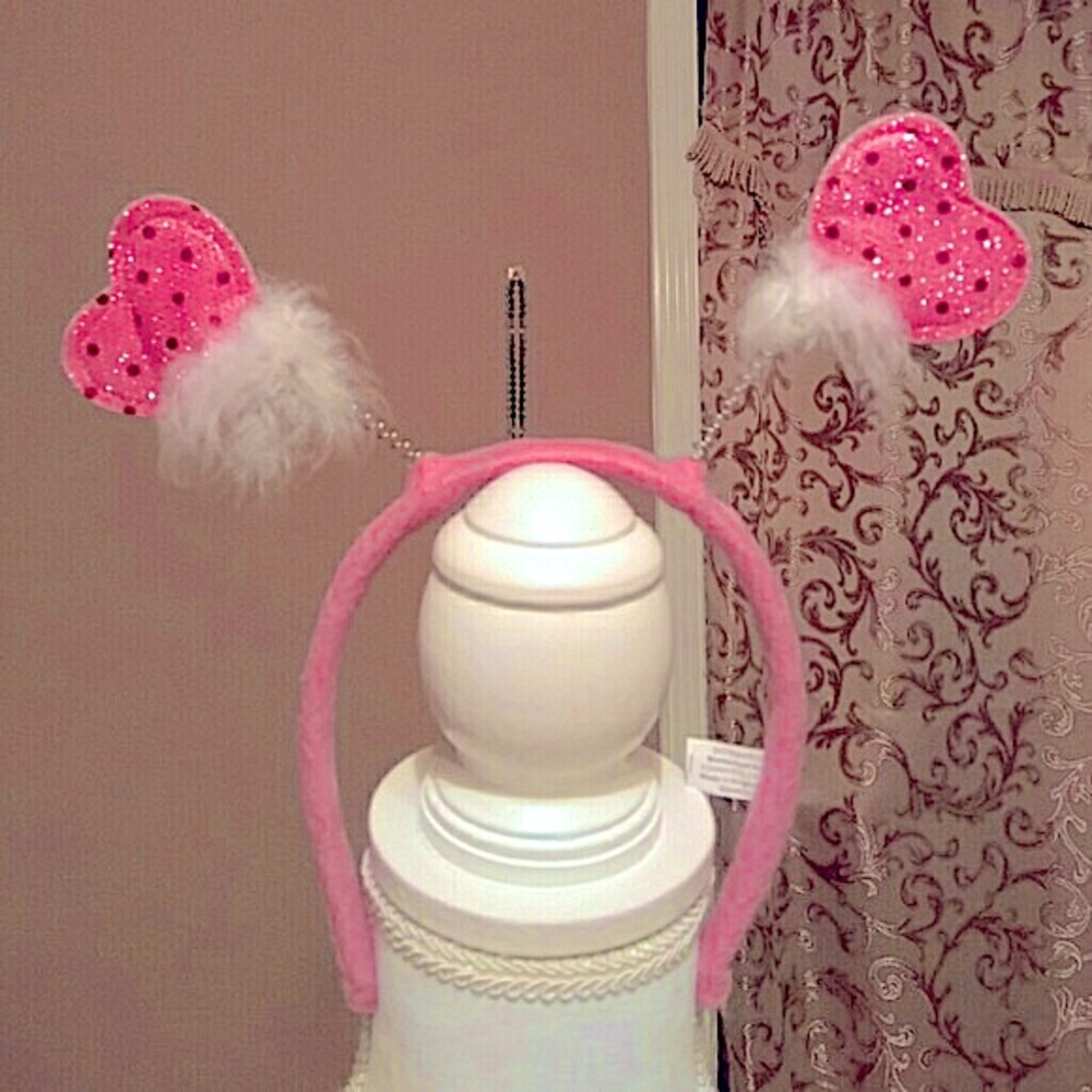 Cute sparkling pink felt and feathers head band